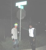 Erick, Chris hold street sign at 3rd and Broadway on January 20, 2003 Monday Night Skate.