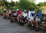 Barbara, Chad, Mari, Steve, Mitchell, Dean, Jason, and John rest at the marina on the May 6, 2002 Monday Night Skate.