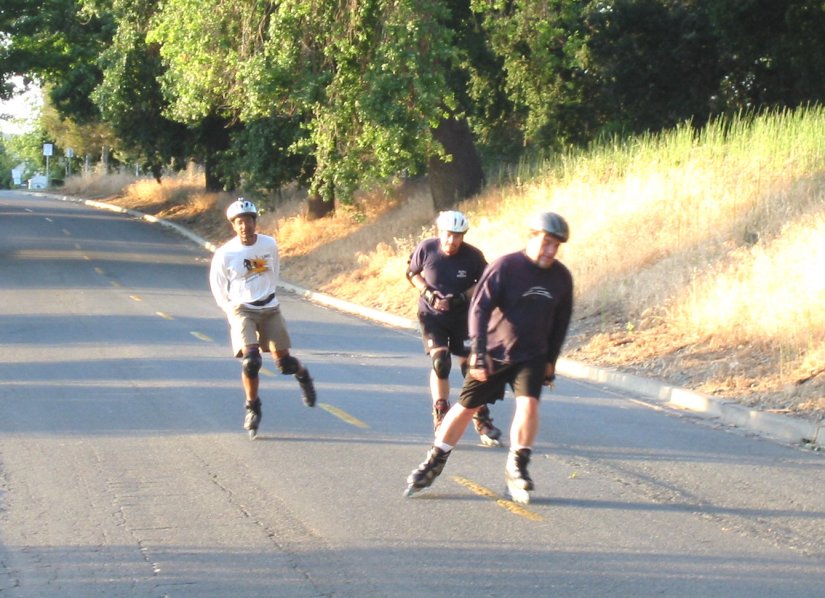 Bryan, Gordon, and Mitchell skate South  on Ramp Street on the May 10, 2004 Monday Night Skate.