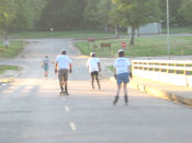 Gordon, Ken, Stuart, and Charity zoom into Discovery Park on the May 15, 2006 Monday Night Skate.