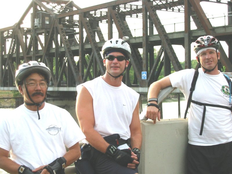 Ron, Will, and Craig pose in front of the I Street Bridge on the June 28, 2004 Monday Night Skate.