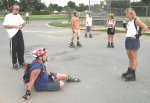 Skaters - Trevor, Tim, Chad, Kevin, Mitchell, Chris, Daedre, Barbara - 
    regroup on the July 29, 2002 Monday Night Skate.