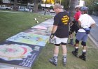 Skaters Bobby, Steve, and Larry looking at chalk art on September 3, 2001 Monday Night Skate.