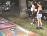 Steve and Casey look at chalk art on the September 6, 2004 Monday Night Skate.