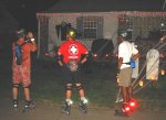Mitchell, Steve, Bryan, look at a Halloween decorated house near Elvas Avenue on the October 6, 2003 Monday Night Skate.