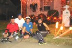 Captain Rollerblade (Bernie), John, Speed Racer (Guy), and Pussie Cat (Yvonne) pose at Halloween decorated house on the October 27, 2003 Monday Night Skate.  Photo by Bryan.