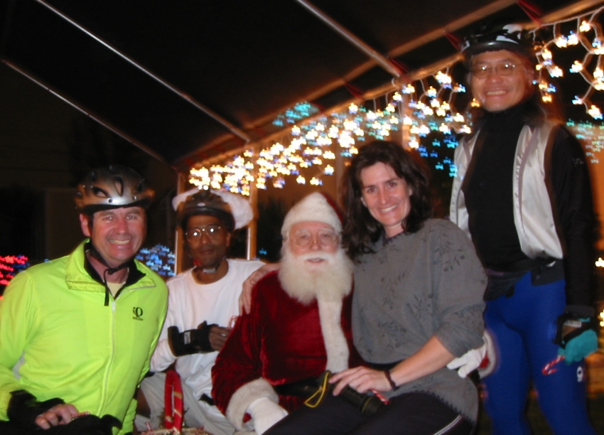 Gordon,  Brian, Santa Claus (Joe), Rachael, and Gerald pose near 53rd and S on the December 13, 2004 Monday Night Skate.