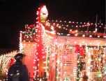Mari Tonin, Founder of the Monday Night Skate, looks at Christmas lights on the December 18, 2000, Monday Night Skate.